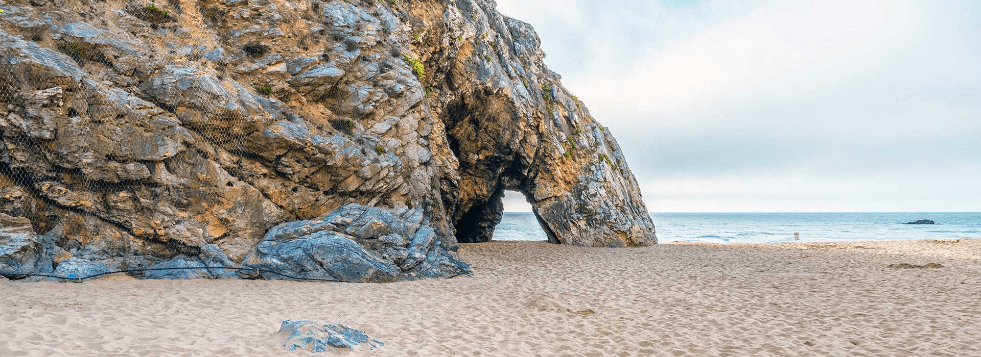 Praia da Adraga beach with rock formations